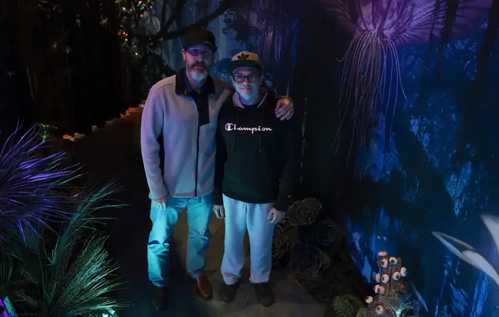 Login’s Sr Account Manager Dan Multhup and his son TJ at the TRAK Avatar screening