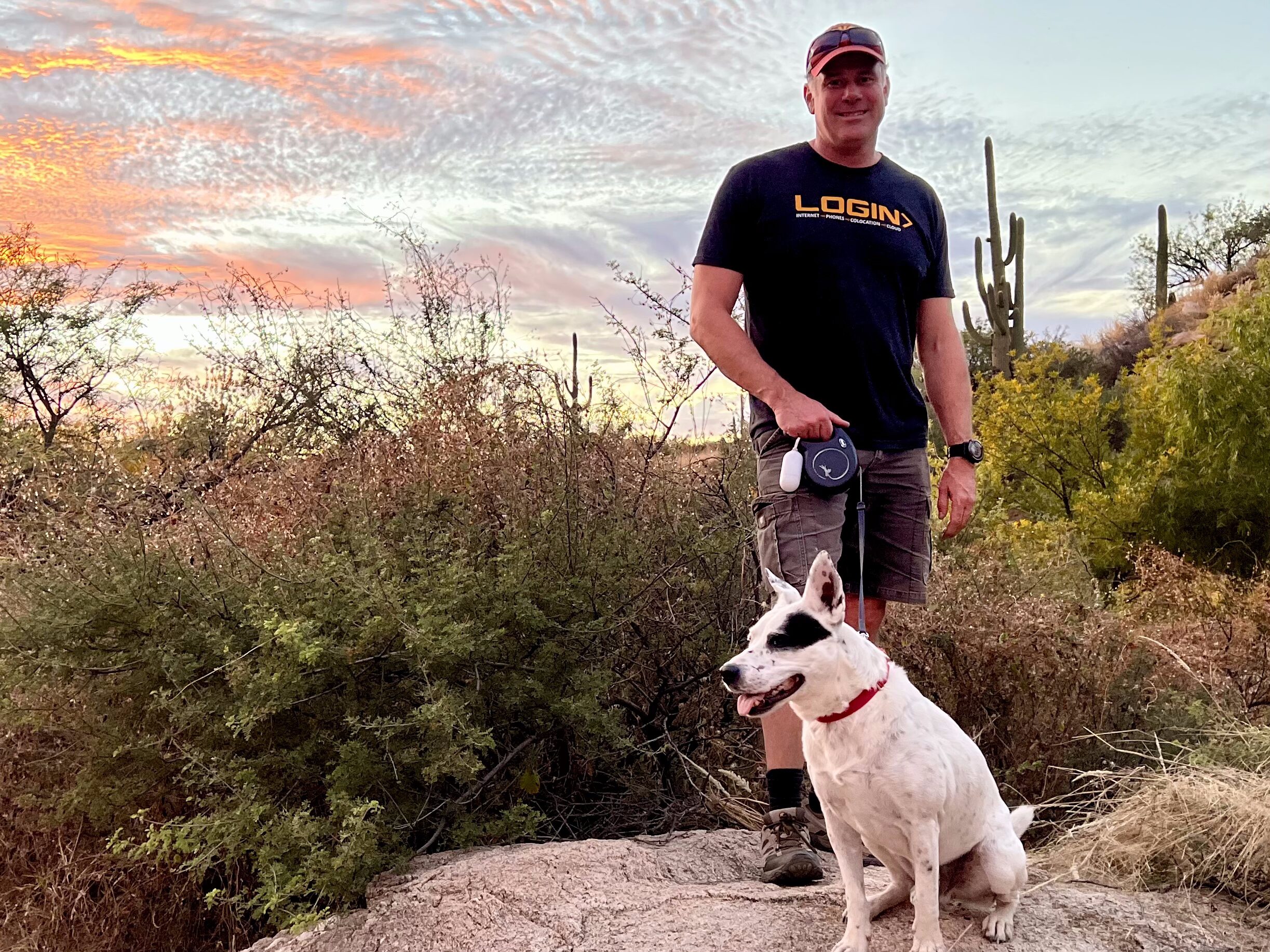 Matt, founder of Login, outdoors at sunset with his dog